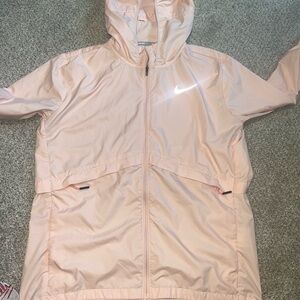 Pink Nike windbreaker and hoodie